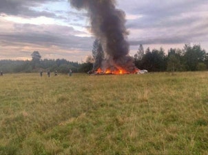 caption: A view of the site after a jet crashed in Russia's northwestern Tver region on Aug. 23. Russian authorities say Wagner chief Yevgeny Prigozhin was among those on the flight manifest. Russian President Vladimir Putin expressed condolences to families of those killed in the crash. He noted Wagner members were reportedly on board and spoke warmly of his relationship with Prigozhin in the past tense.