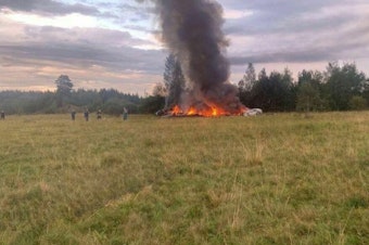 caption: A view of the site after a jet crashed in Russia's northwestern Tver region on Aug. 23. Russian authorities say Wagner chief Yevgeny Prigozhin was among those on the flight manifest. Russian President Vladimir Putin expressed condolences to families of those killed in the crash. He noted Wagner members were reportedly on board and spoke warmly of his relationship with Prigozhin in the past tense.