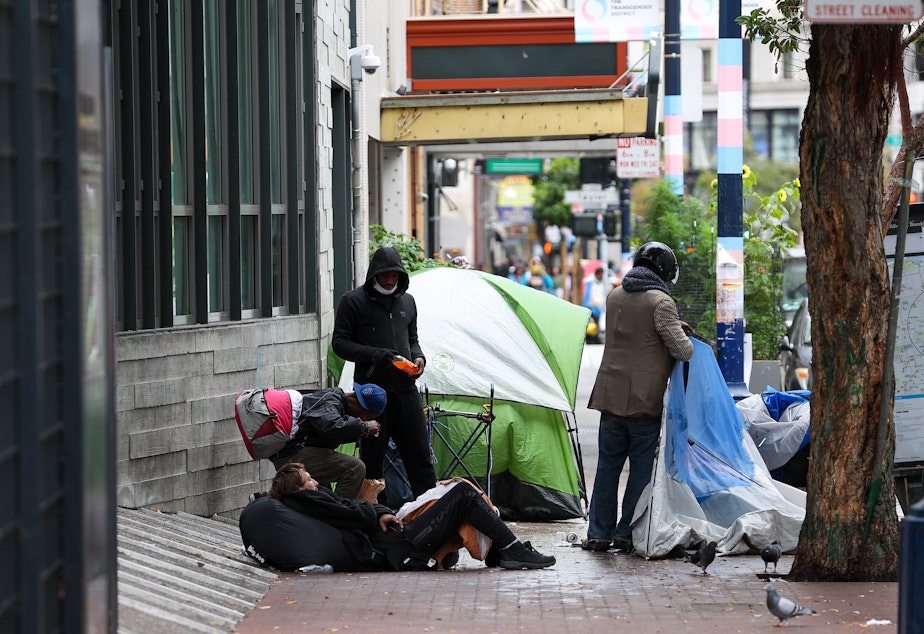caption: The problems in the San Francisco neighborhood Tenderloin — homelessness, poverty, substance abuse and crime — have plagued the area for decades.