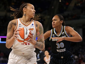 caption: Brittney Griner (left) of the Phoenix Mercury is defended by Azurá Stevens of the Chicago Sky during Game 4 of the WNBA Finals at Wintrust Arena in Chicago, Illinois, on Oct. 17, 2021.