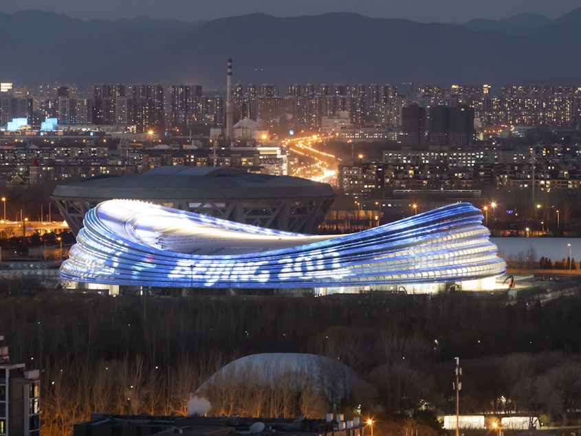 caption: The National Speed Skating Oval, also known as the Ice Ribbon, is the venue for speed skating events at the Beijing 2022 Winter Olympics.