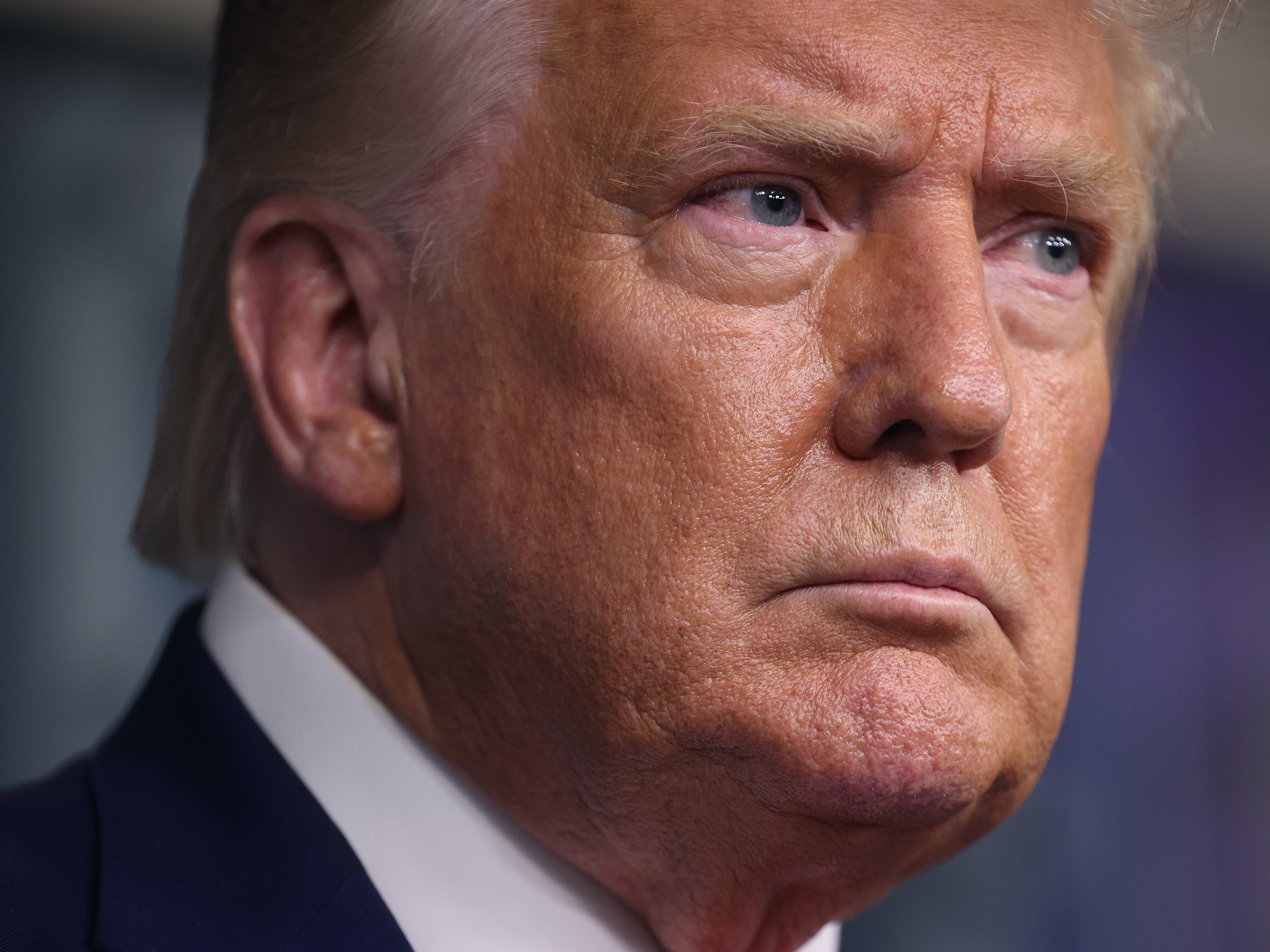caption: President Trump speaks to the media Monday from the White House.