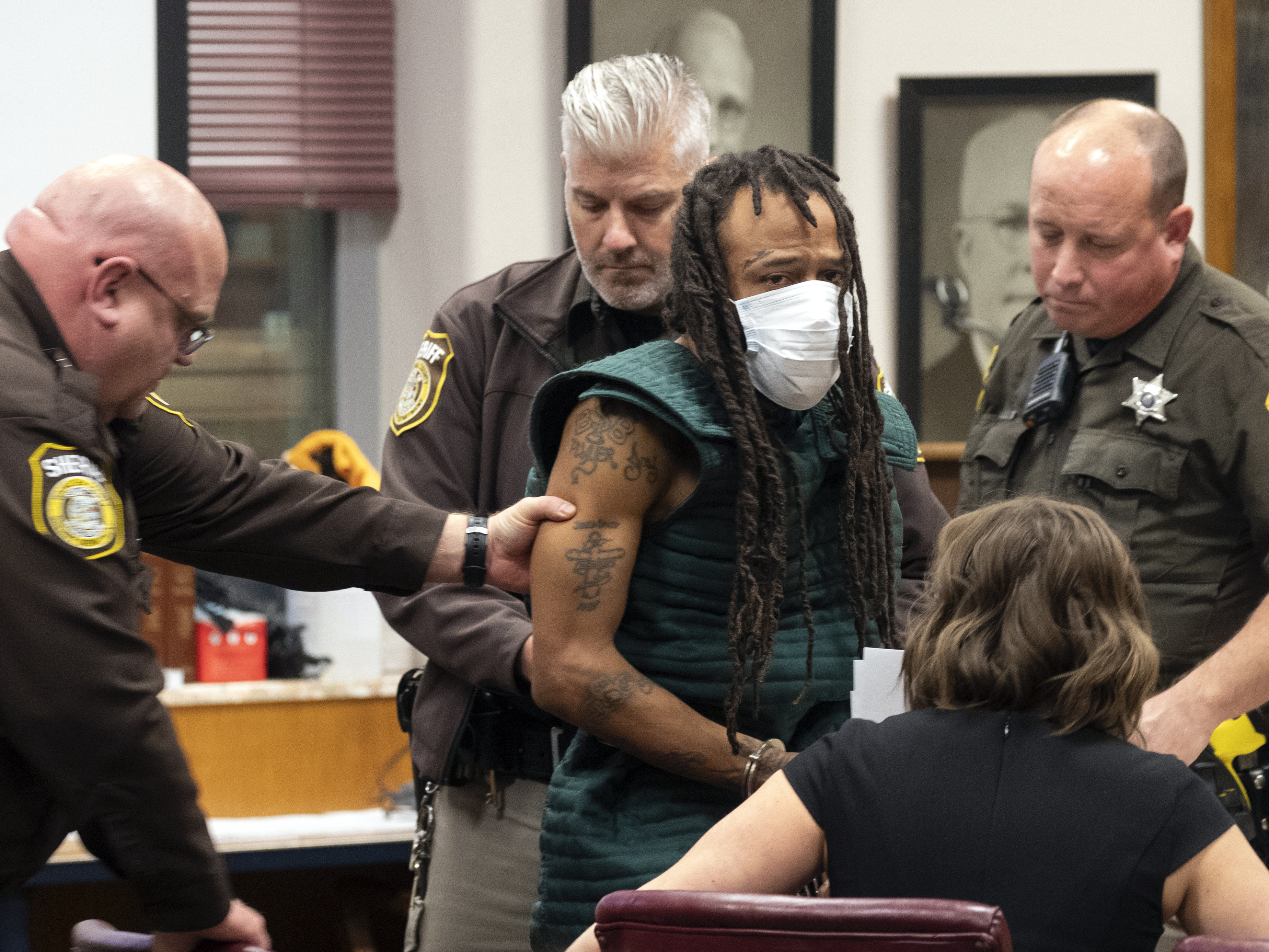 caption: Darrell Brooks Jr. makes his initial court appearance on Tuesday in Waukesha, Wis. Prosecutors in Wisconsin have charged Brooks with intentional homicide in the deaths of at least five people who were killed when an SUV was driven into a Christmas parade.