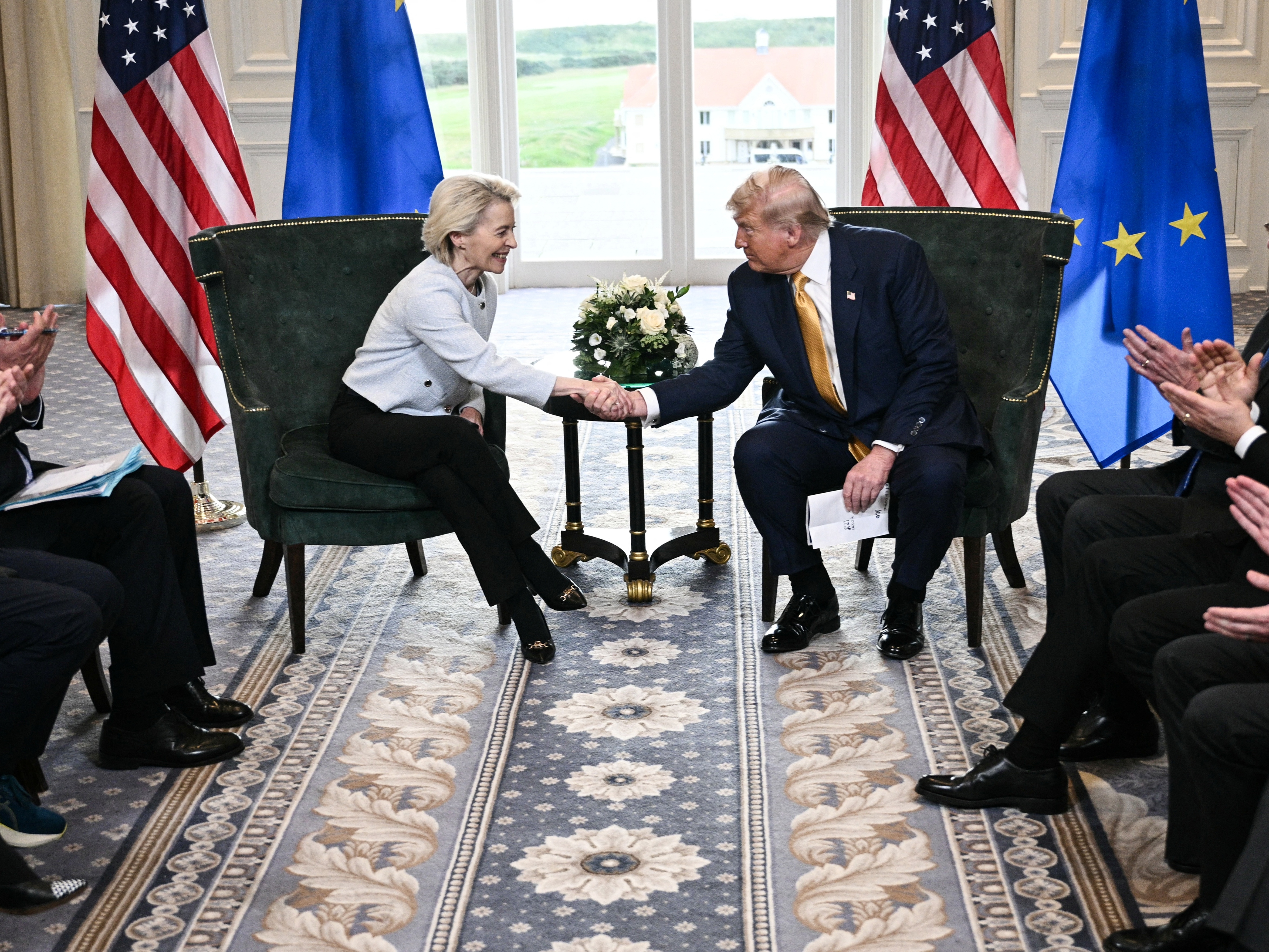 caption: President Trump shakes hands with European Commission President Ursula von der Leyen on July 27, 2025 at his golf resort in Turnberry, Scotland, after the two leaders agreed to terms for a trade deal.