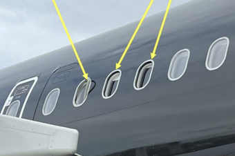 caption: A photo included in the U.K.'s Air Accidents Investigations Branch special bulletin shows the location of one damaged and two missing window panes on an Airbus A321.
