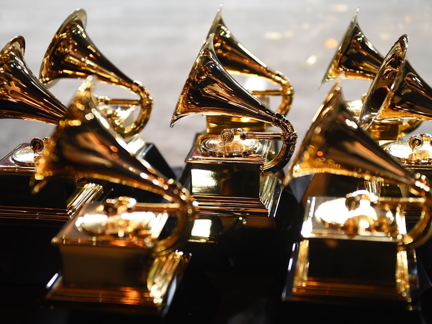 caption: Grammy trophies sit in the press room during the 60th Annual Grammy Awards, held in New York in Jan. 2018.