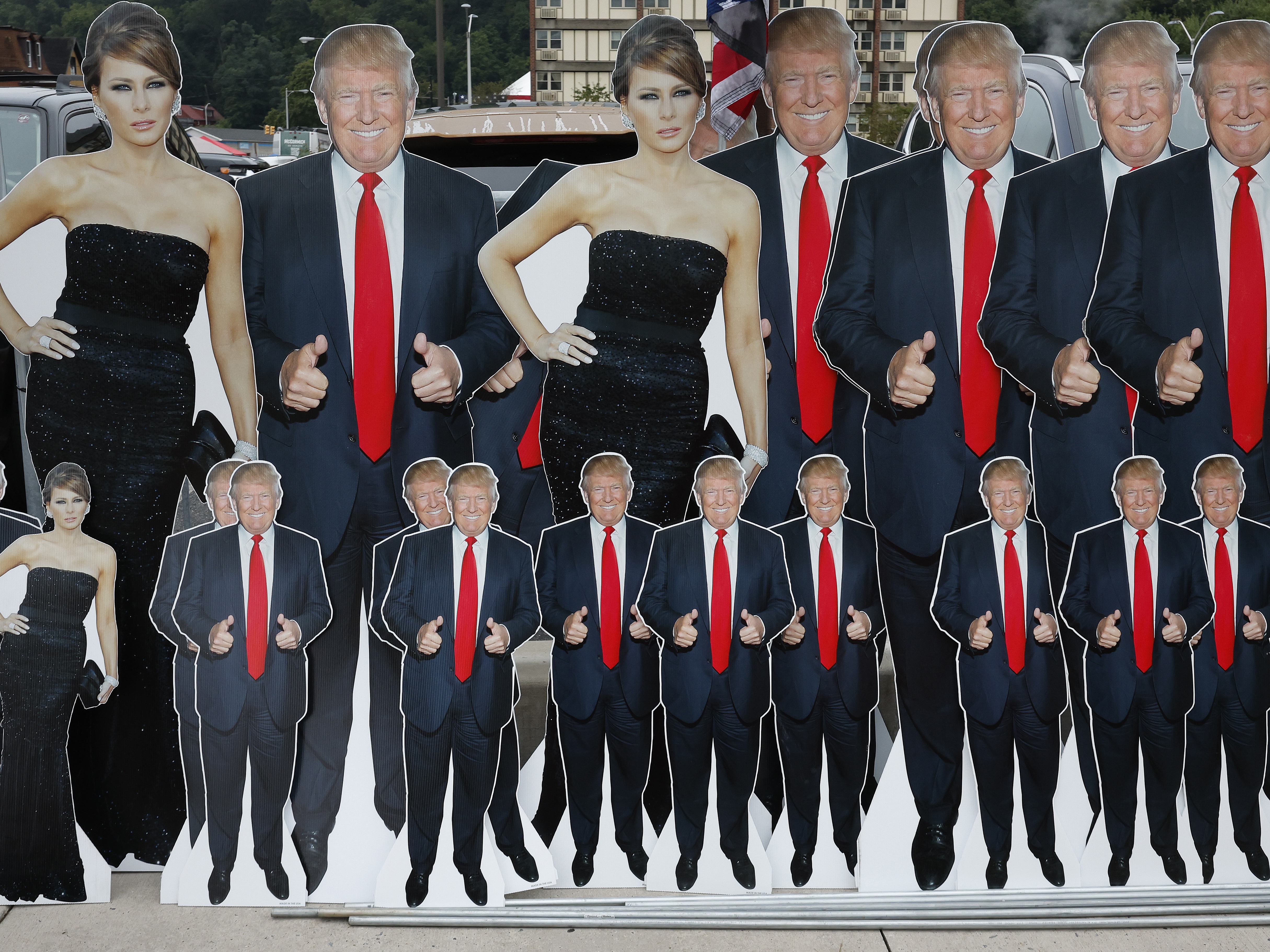 caption: “Why should anyone other than the woman herself have the power to determine what she does with her own body?" Melania Trump asks in her new memoir, according to an early excerpt published by The Guardian. The former first lady is seen here alongside her husband, former President Donald Trump, in cardboard cutouts at a campaign rally in Johnstown, Pa.