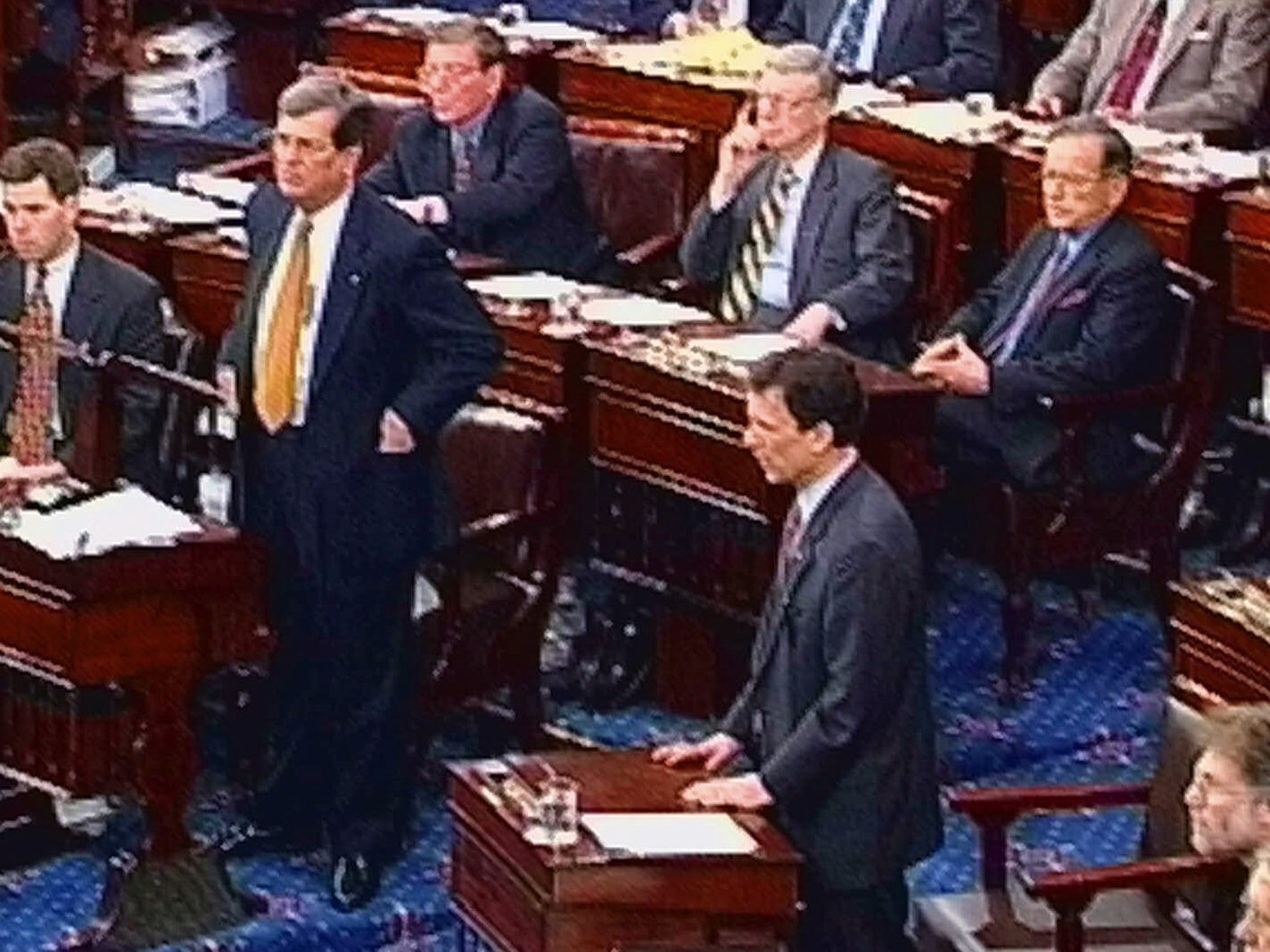 caption: Senate Majority Leader Trent Lott and Minority Leader Tom Daschle, shown in this video image from February 1999, speak during the impeachment trial of President Bill Clinton on the Senate floor.