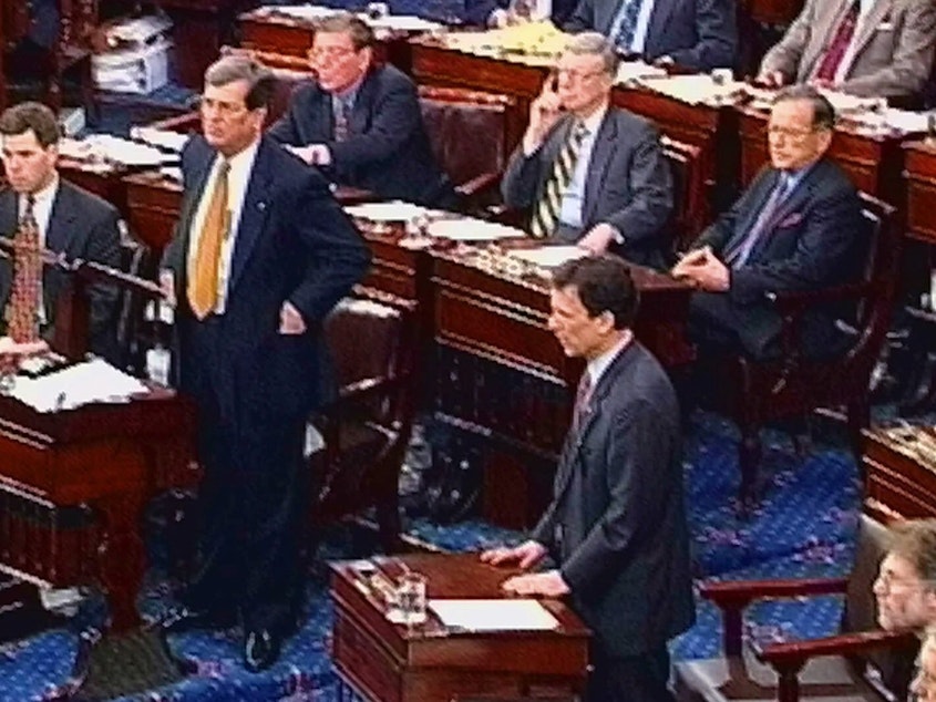 caption: Senate Majority Leader Trent Lott and Minority Leader Tom Daschle, shown in this video image from February 1999, speak during the impeachment trial of President Bill Clinton on the Senate floor.