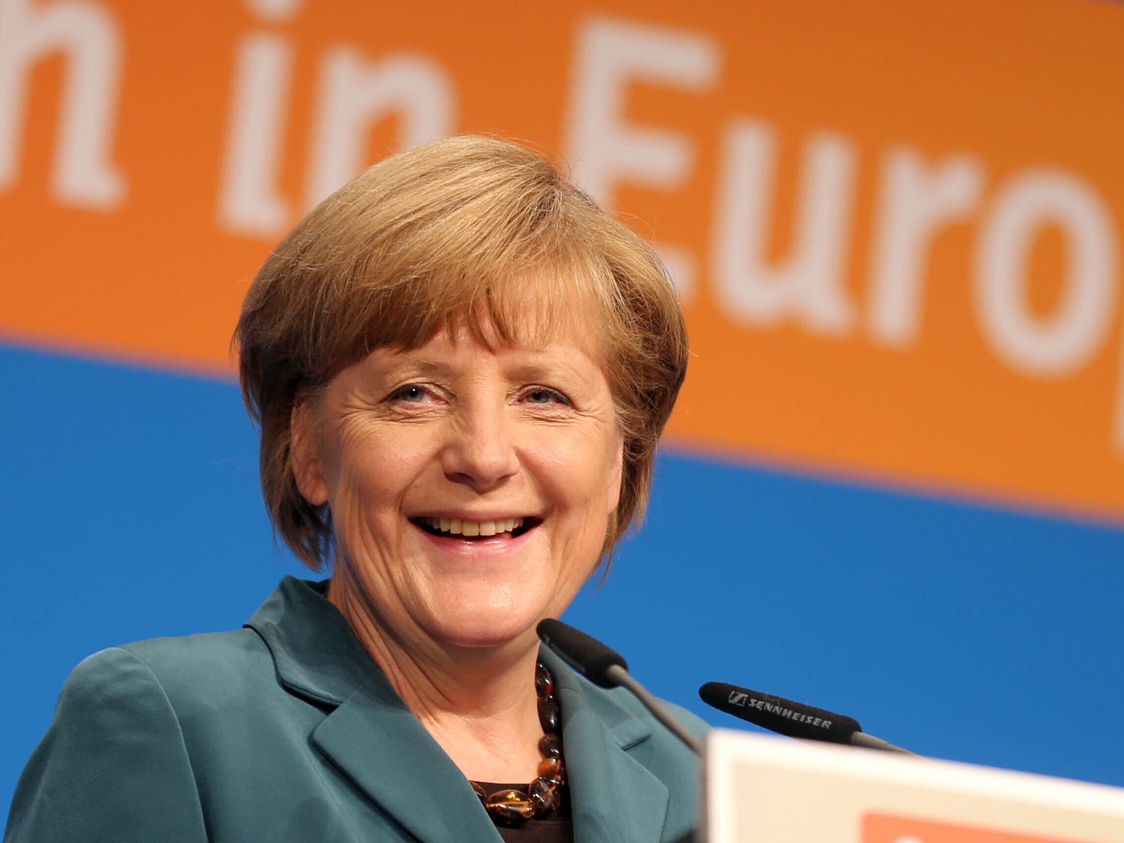 caption: A file photo from April 30, 2014, shows then-German Chancellor Angela Merkel attending the parliamentary election campaign program for Hesse State, at the Frankfurt's Kap European Congress Center in Frankfurt, Germany.