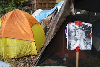 caption: Portland Homeless camp