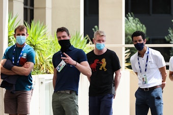 caption: People associated with the Australian Open are seen lining up at a testing facility at the View Hotel on Thursday in Melbourne, Australia. Victoria state has reintroduced COVID-19 restrictions after a hotel quarantine worker tested positive for the coronavirus on Wednesday.