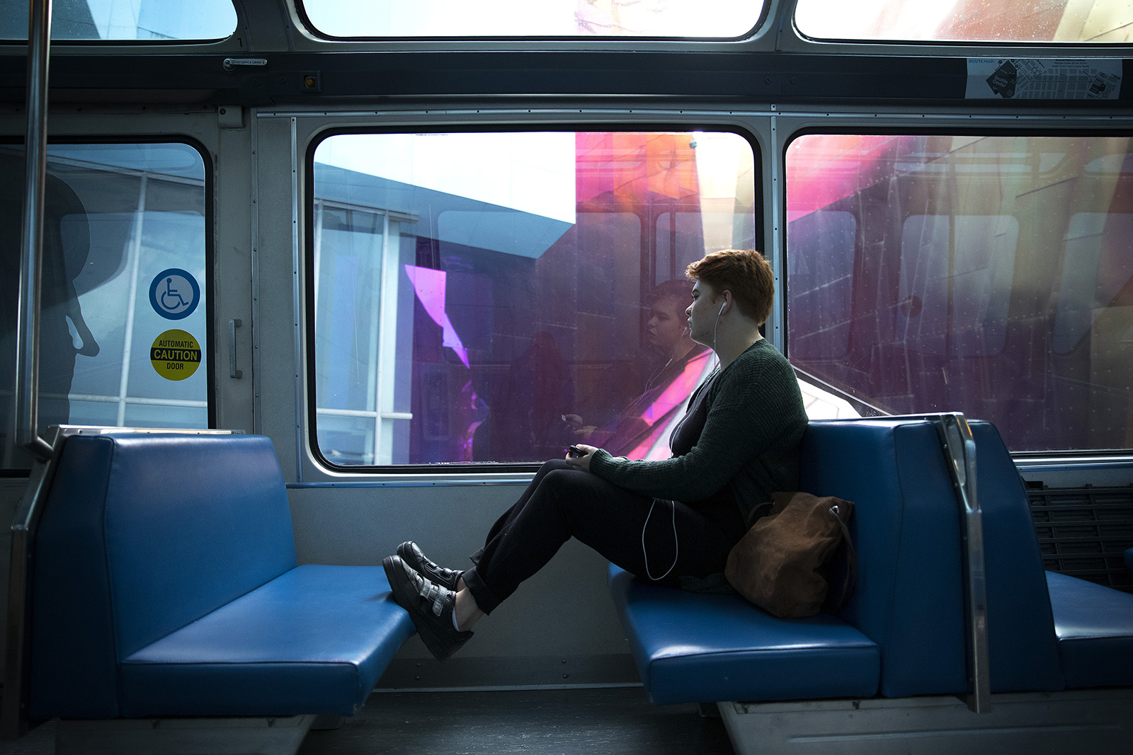 caption: Fiona 'Jell' Pena-Rolla commutes on the Monorail to Seattle Center on Wednesday, August 30, 2017, in Seattle.