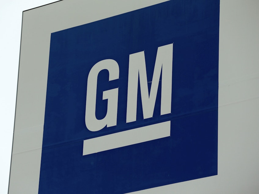 caption: A sign is seen outside of a General Motors plant in Detroit,  on Jan. 27, 2020. GM said on Thursday it is idling more plants as it continues to deal with a shortage of chips.