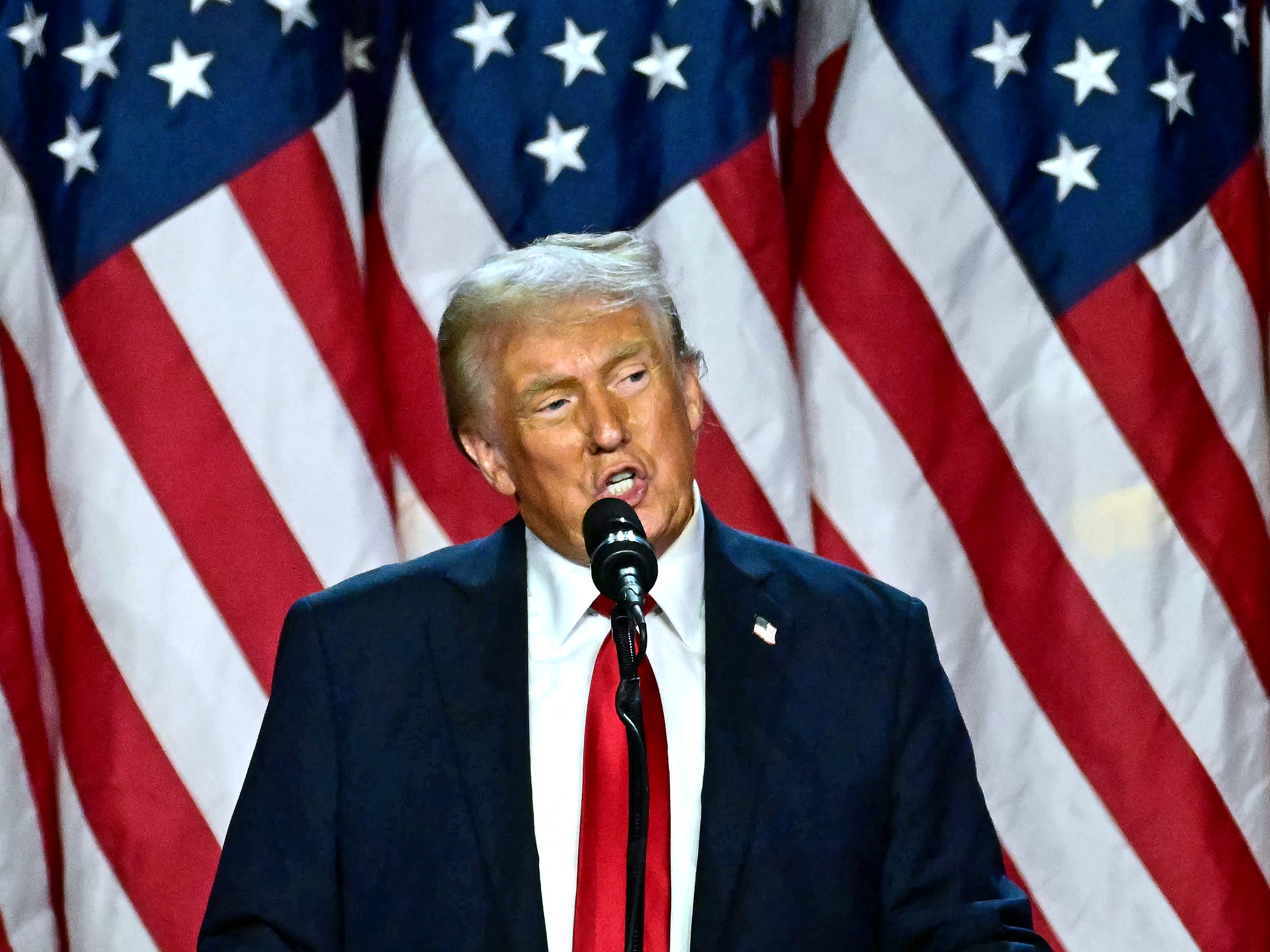 caption: Former US President and Republican presidential candidate Donald Trump speaks during an election night event in West Palm Beach, Florida, on Nov. 6. Trump secured the victory, in part, by shifting Democratic counties toward the right.