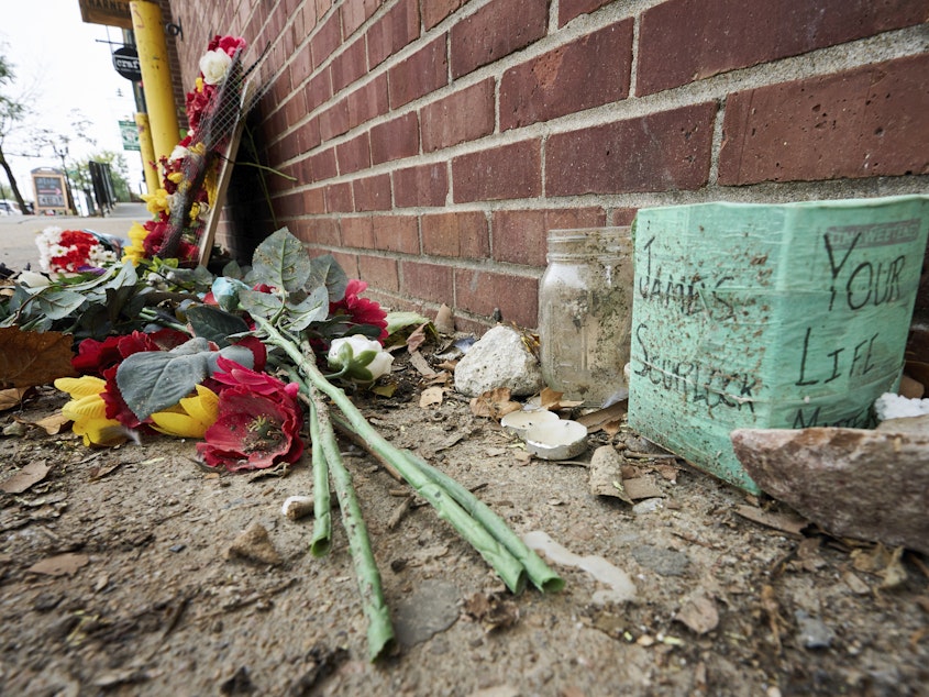 caption: The site of James Scurlock's shooting death in Omaha, Neb., is still being preserved as a memorial in mid-September. On Tuesday, a grand jury indicted Jake Gardner in the killing, handing down four charges including manslaughter.