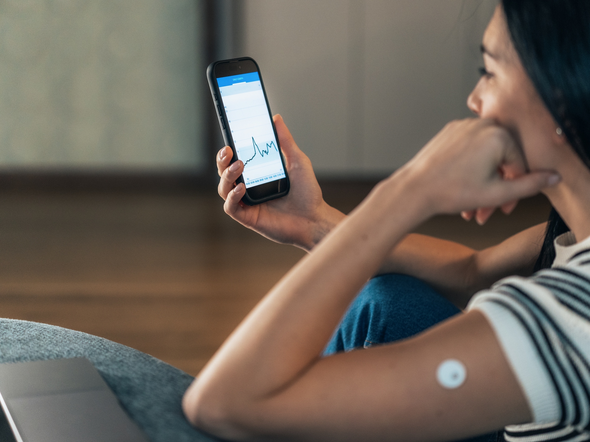 caption: A continuous glucose monitor helps people track their blood sugar spikes and dips.