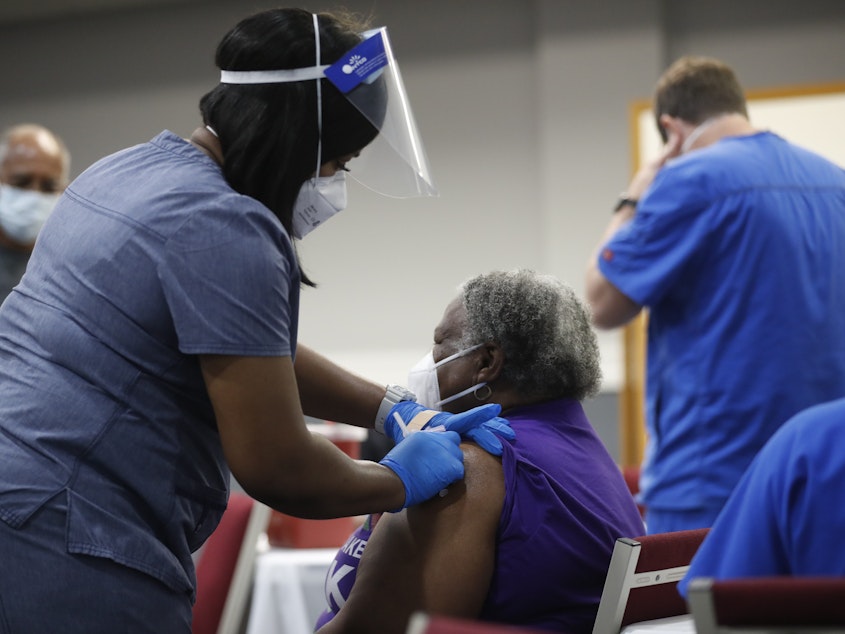 caption: A new report from the Black Coalition Against COVID highlights the racial disparities and health inequities Black Americans continue to face in the pandemic.