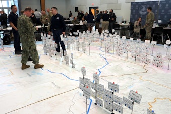 caption: Emergency planners could move pins representing earthquake response resources during an exercise at Camp Murray, Washington, on May 4.