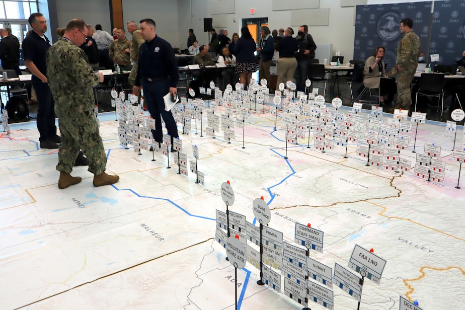 caption: Emergency planners could move pins representing earthquake response resources during an exercise at Camp Murray, Washington, on May 4.