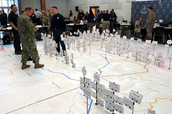 caption: Emergency planners could move pins representing earthquake response resources during an exercise at Camp Murray, Washington, on May 4.