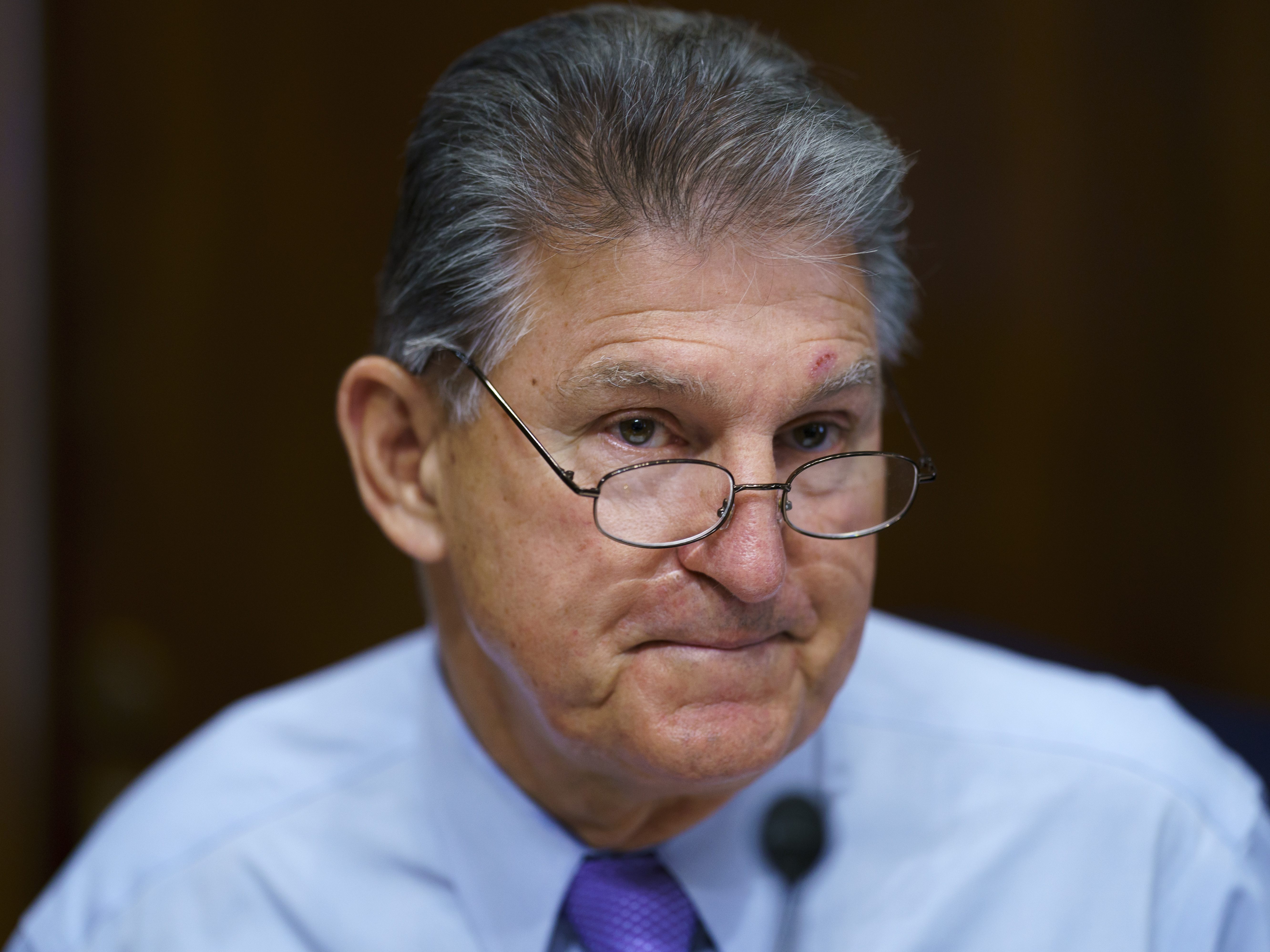 caption: Sen. Joe Manchin, D-W.Va., has called on Democrats to pause the effort to push through a $3.5 trillion budget.