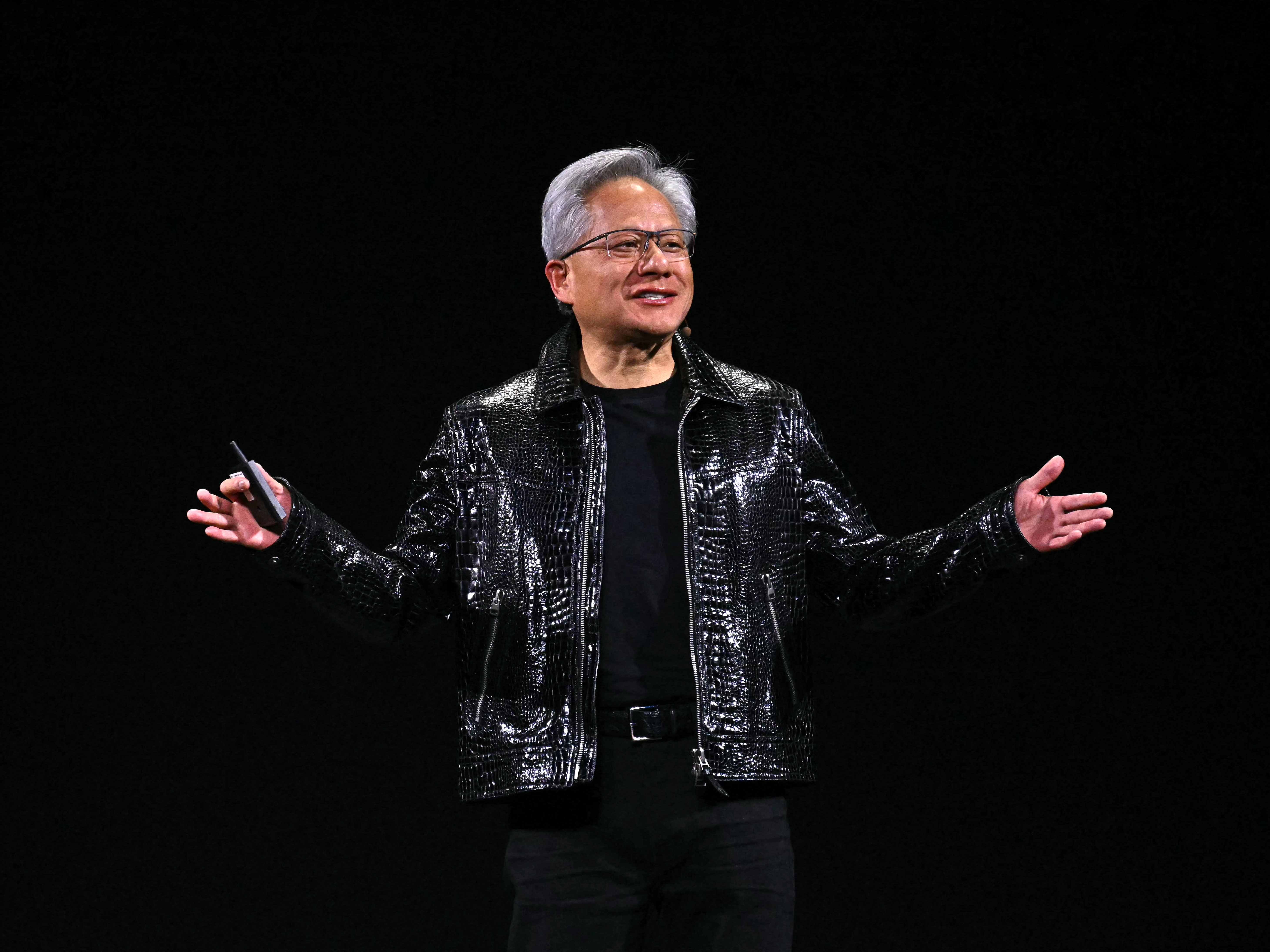 caption: Nvidia CEO Jensen Huang delivers a keynote address at the Consumer Electronics Show (CES) in Las Vegas in January.