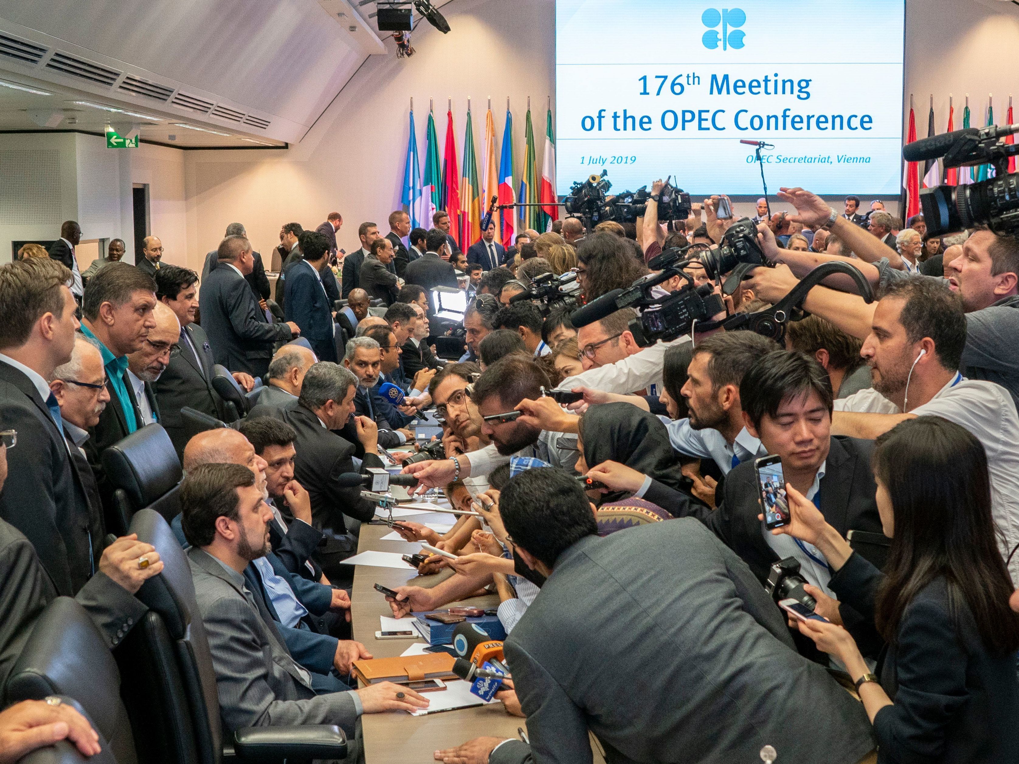 caption: Journalists interview oil ministers on the sidelines of the 176th meeting of the Organization of the Petroleum Exporting Countries conference on Monday in Vienna, Austria.