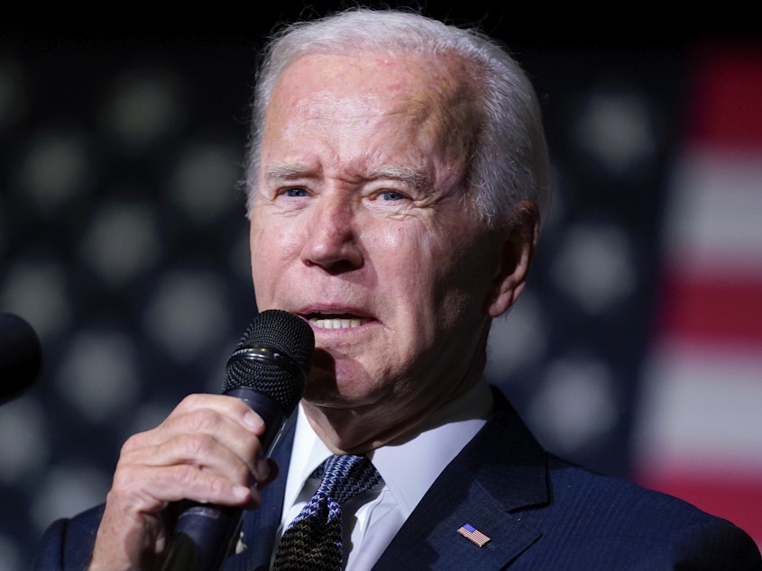 caption: President Joe Biden speaking about student loan debt relief at Delaware State University, Oct. 21, 2022, in Dover, Del. The Biden administration said it is extending the student loan repayment pause again.