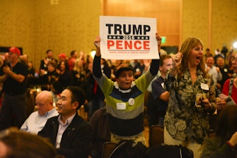caption: A boy cheers at the Republican watch party in Bellevue on Tuesday night, as Donald Trump clinches Florida.