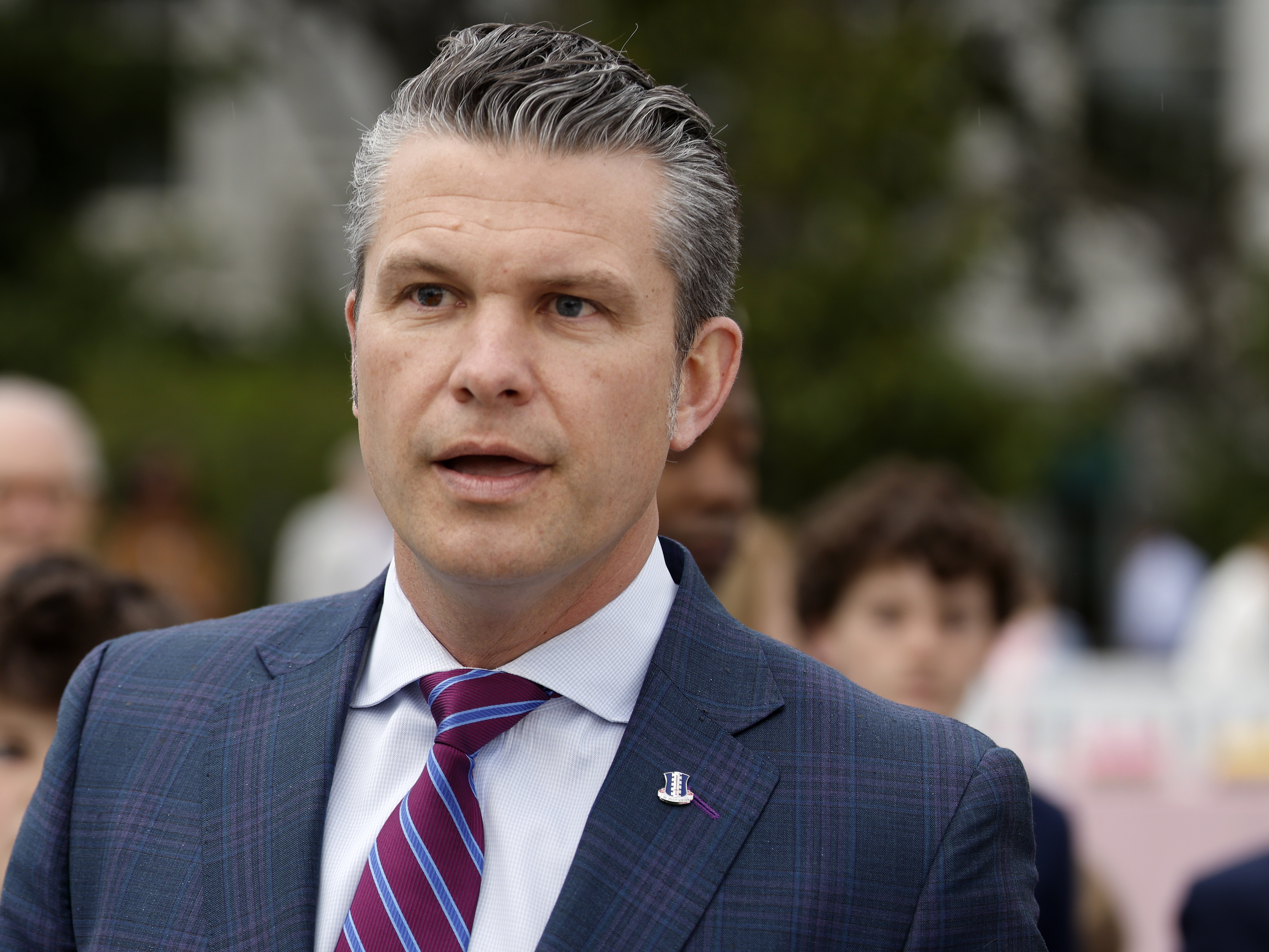 caption: Secretary of Defense Pete Hegseth speaks to reporters during the White House Easter Egg Roll on the South Lawn of the White House on April 21, the day after <em>The New York Times </em>reported that he shared information last month to a second private Signal group chat about upcoming strikes in Yemen.