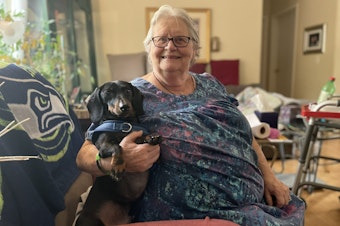 caption: Linda Brown lives in a 55 and over mobile home park in Carnation, Washington with her dachsund, Chavi.