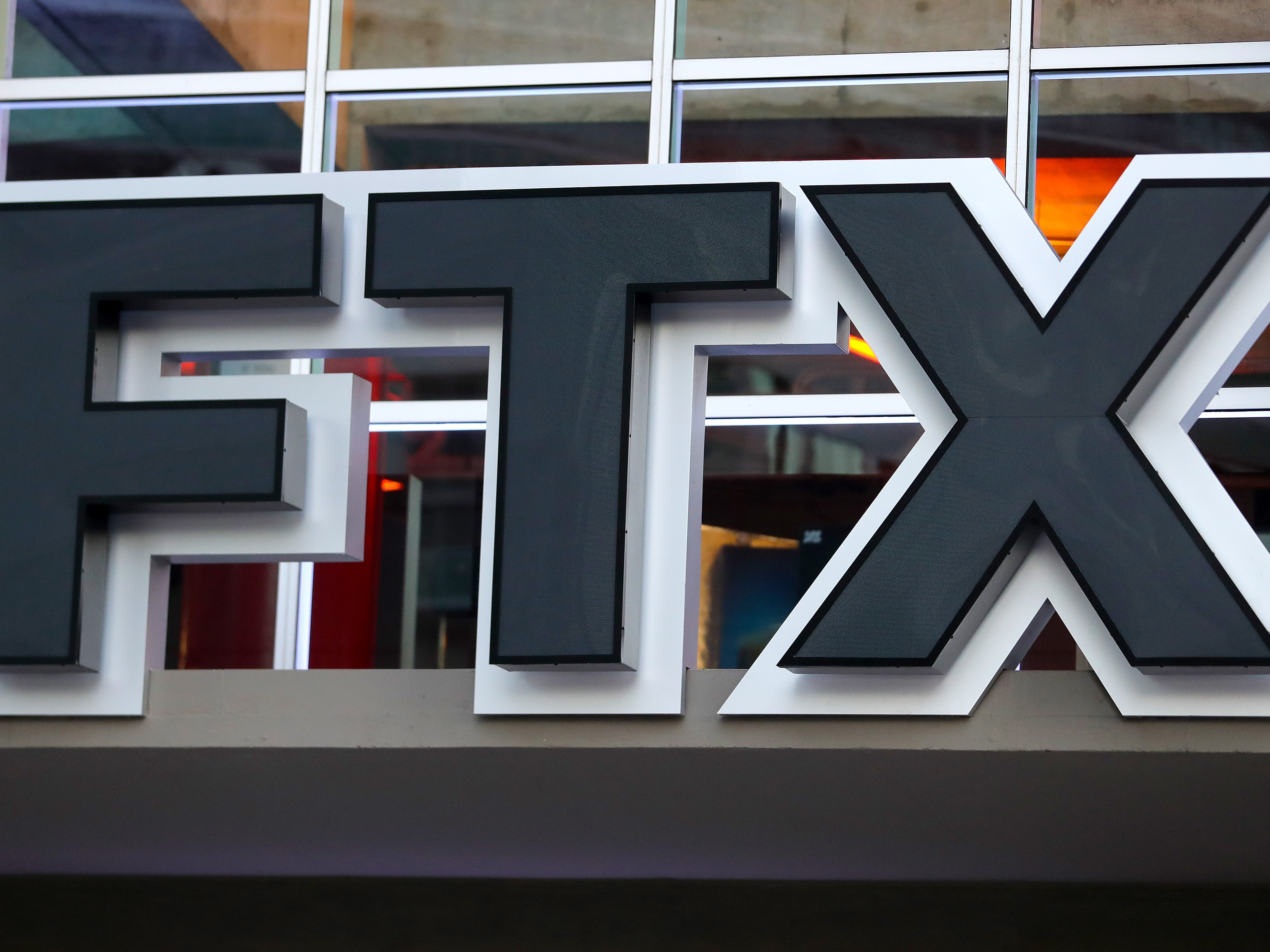 caption: A detailed view of the FTX sign prior to a game between the Phoenix Suns and Miami Heat at FTX Arena on November 14, 2022.