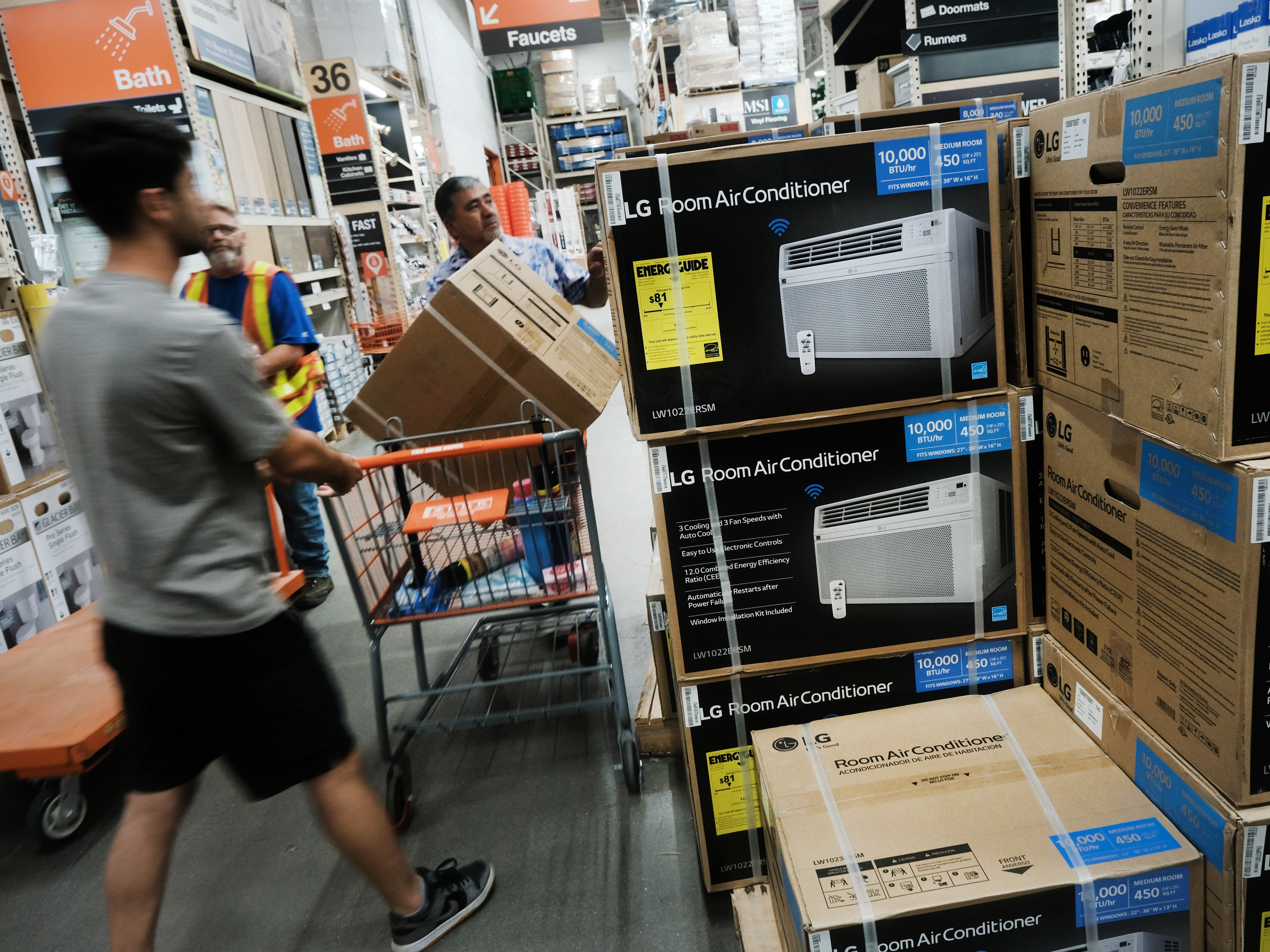 caption: People shop for air conditioners during a heat wave last week in New York City. Many people who live in public housing can't afford such units or the utility bills that come with them — and there's no federal requirement for air conditioning.