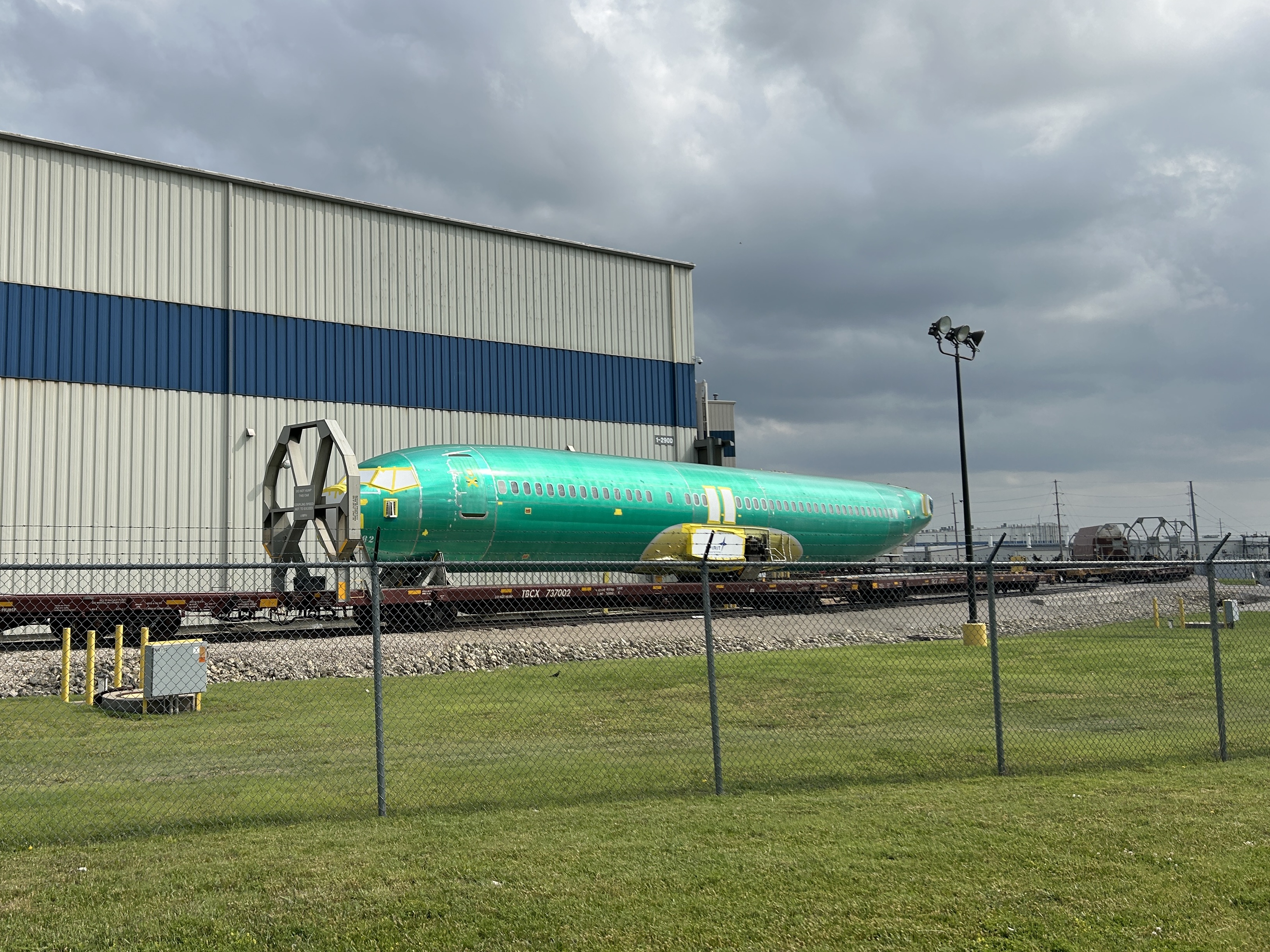 caption:  The fuselage of a Boeing 737 at the Spirit AeroSystems factory in Wichita, Kan.