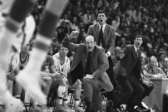 caption: Davidson head coach Lefty Driesell drops to a knee in front of his bench as he watches North Carolina win an NCAA Eastern Regional basketball tournament at College Park, Md., on March 15, 1969. Driesell, the coach whose folksy drawl belied a fiery on-court demeanor that put Maryland on the college basketball map, died Saturday.