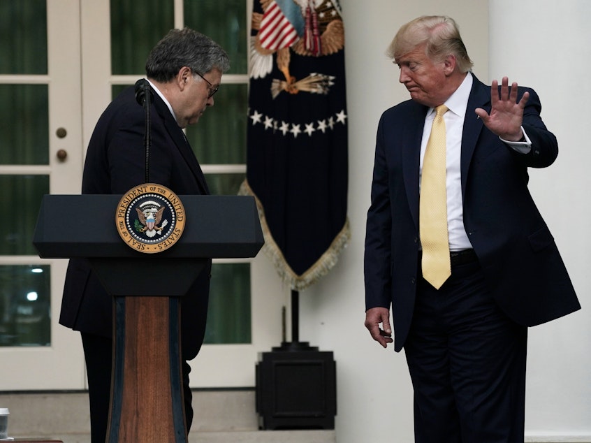 caption: President Trump departs a July 2019 press conference on the census with U.S. Attorney General William Barr (center) and Commerce Secretary Wilbur Ross in the White House Rose Garden.