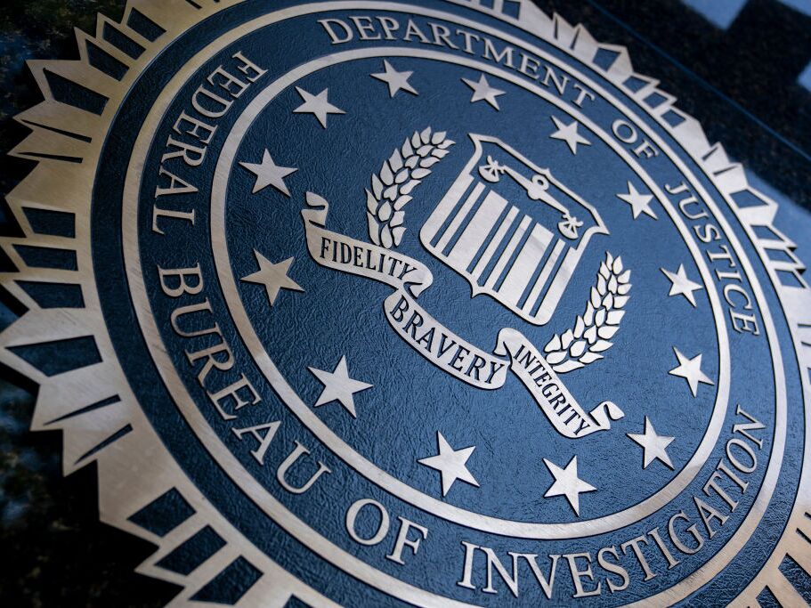 caption: A seal reading "Department of Justice Federal Bureau of Investigation" is displayed on the J. Edgar Hoover FBI building in Washington, D.C., on Aug. 9, 2022.