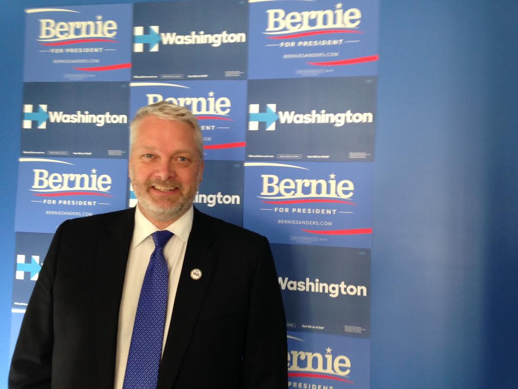 caption: State Democratic Party Chair Jaxon Ravens at this year's caucuses. 