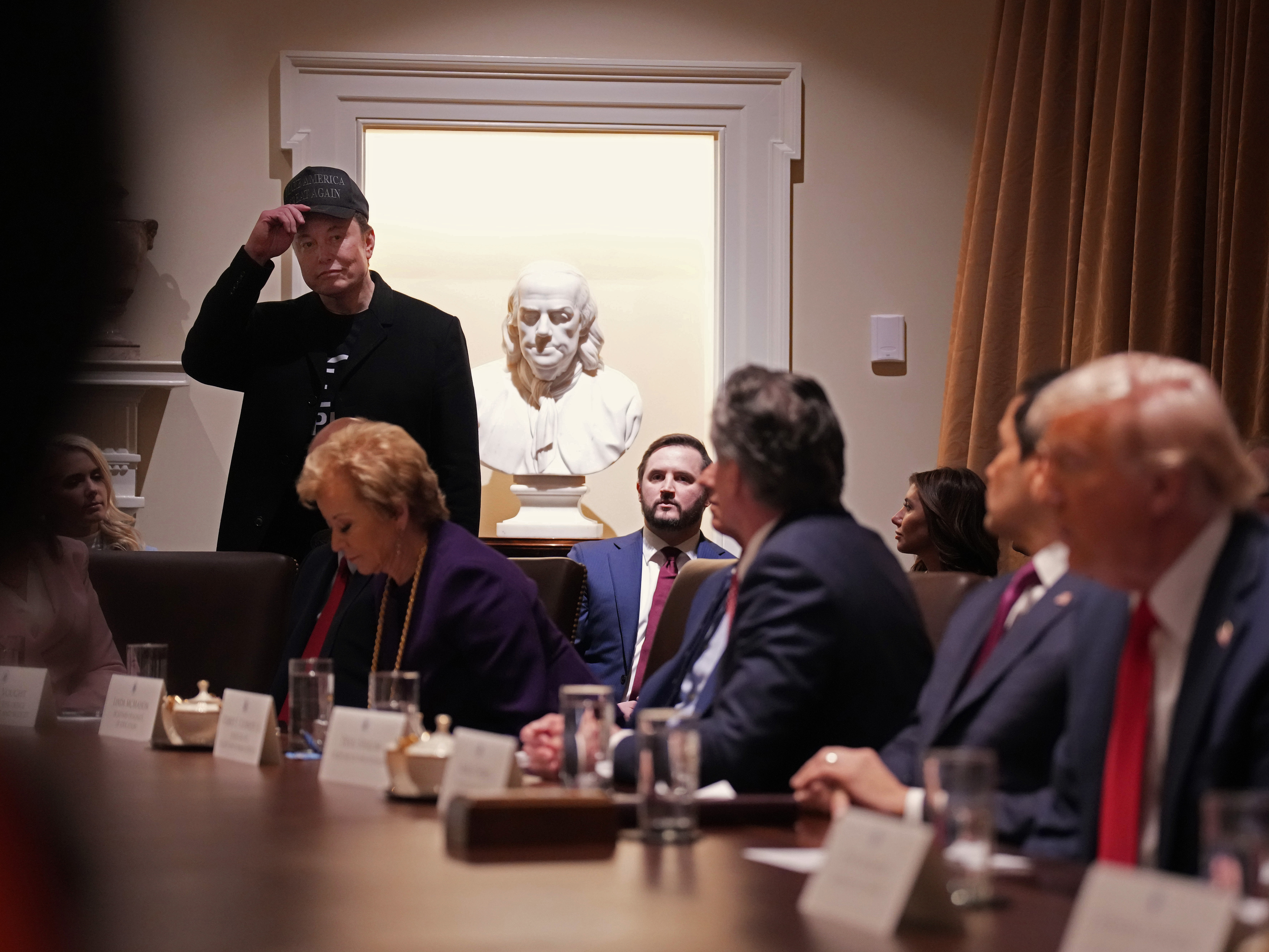 caption: Elon Musk delivers remarks during a Cabinet meeting held by President Trump at the White House on Feb. 26.