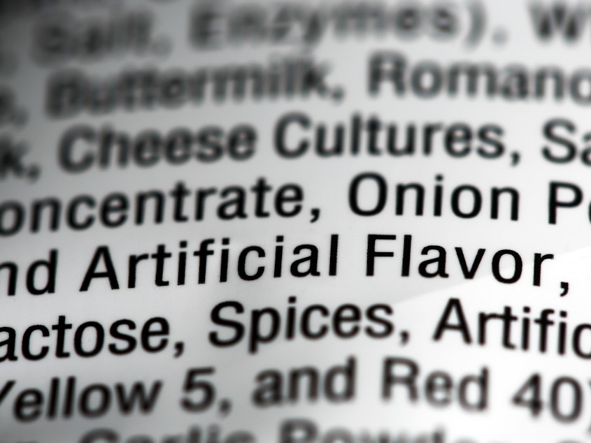 caption: Food additives can help mimic natural flavors and are often simply labeled as "artificial flavors" on labels.