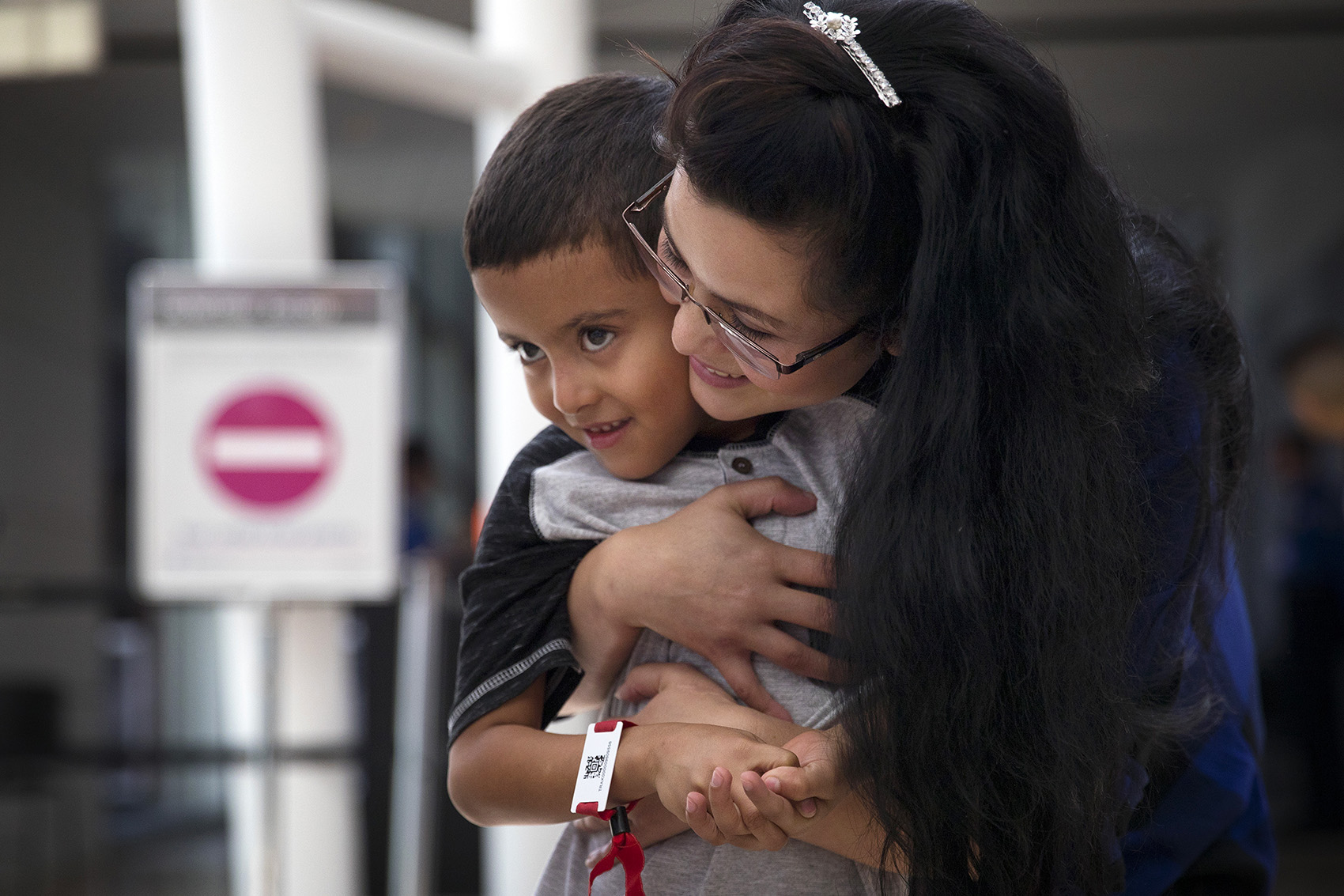 caption: Yolany Padilla hugs her 6-year-old son Jelsin after being reunited on Saturday, July 14, 2018, at Seattle-Tacoma International Airport. Tap or click on the first image to see more.