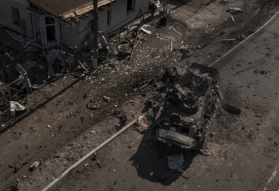 caption: A destroyed Russian vehicle is seen after battles on a main road north of Kyiv, Ukraine. The image of a single vehicle is powerful, but it doesn't tell the whole story.