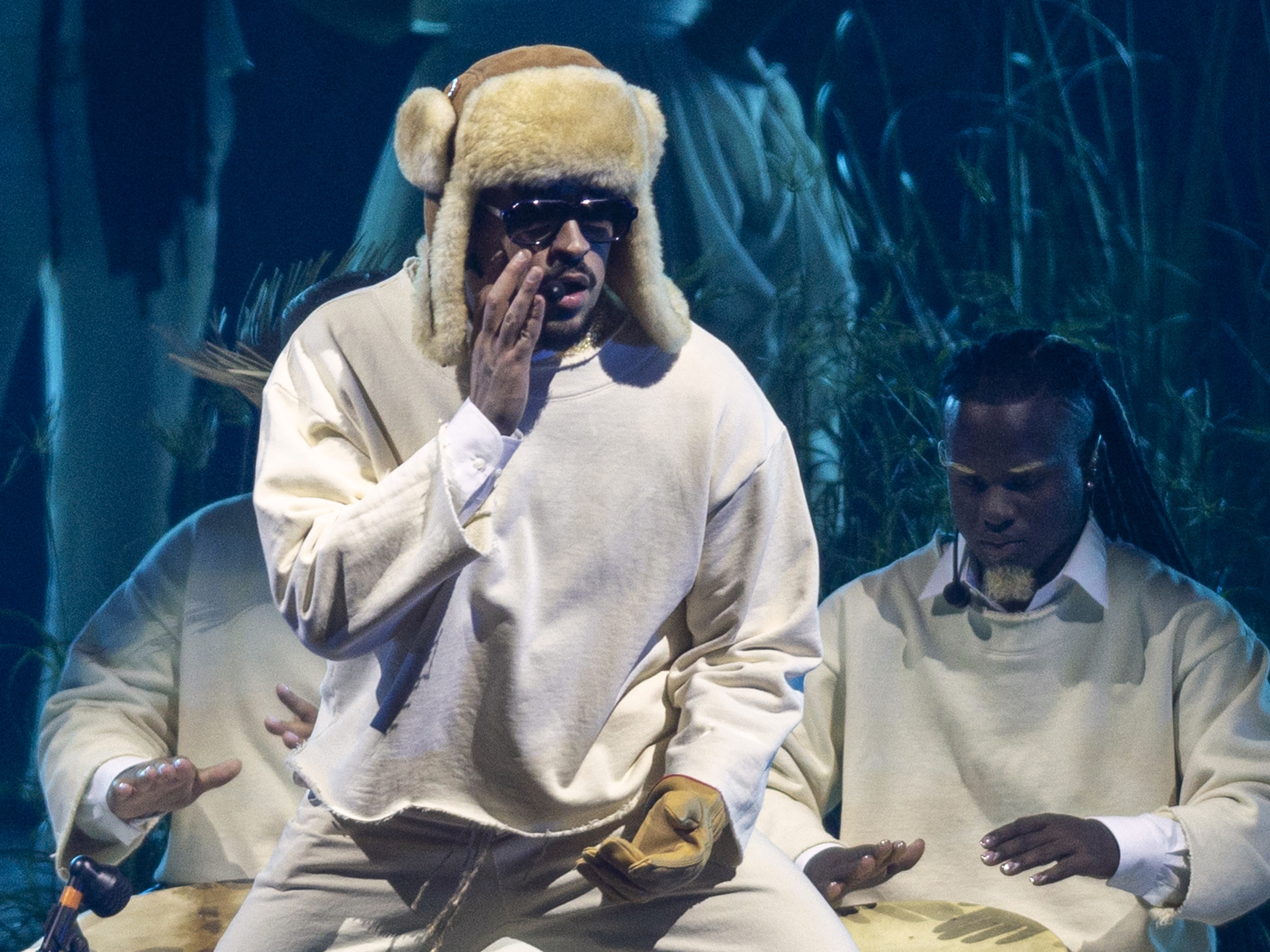 caption: Puerto Rican singer Bad Bunny performing onstage in San Juan on July 11 during the first night of his 30-show residency in Puerto Rico.