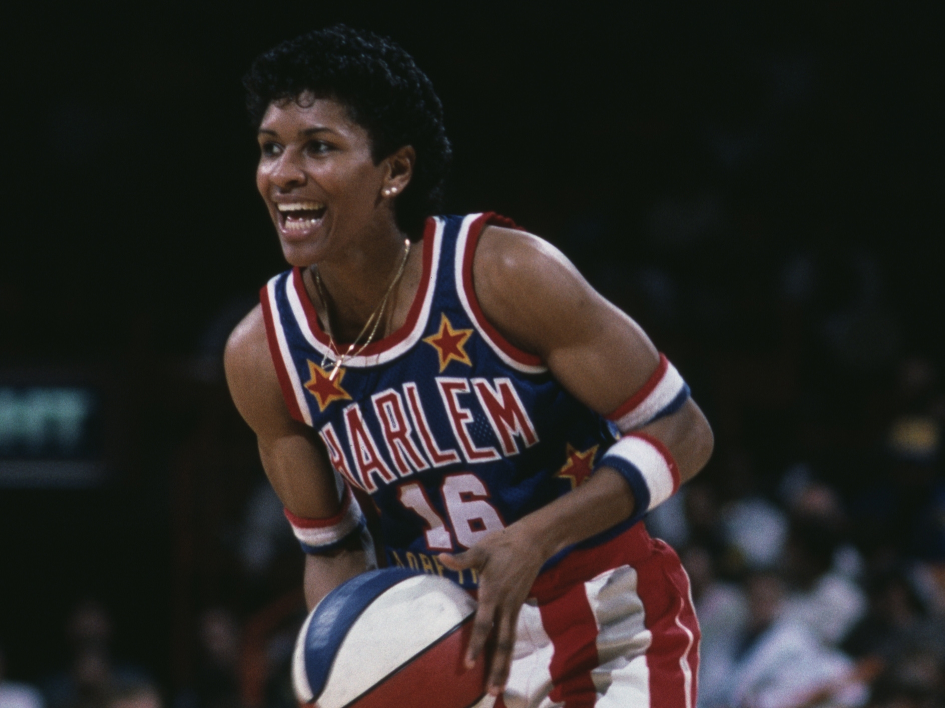 caption: Lynette Woodard plays in 1986 for the Harlem Globetrotters during a game against the Washington Generals at The Forum indoor arena in Inglewood, Calif. In 1985 Woodard became the first woman ever to play with the Harlem Globetrotters basketball team.