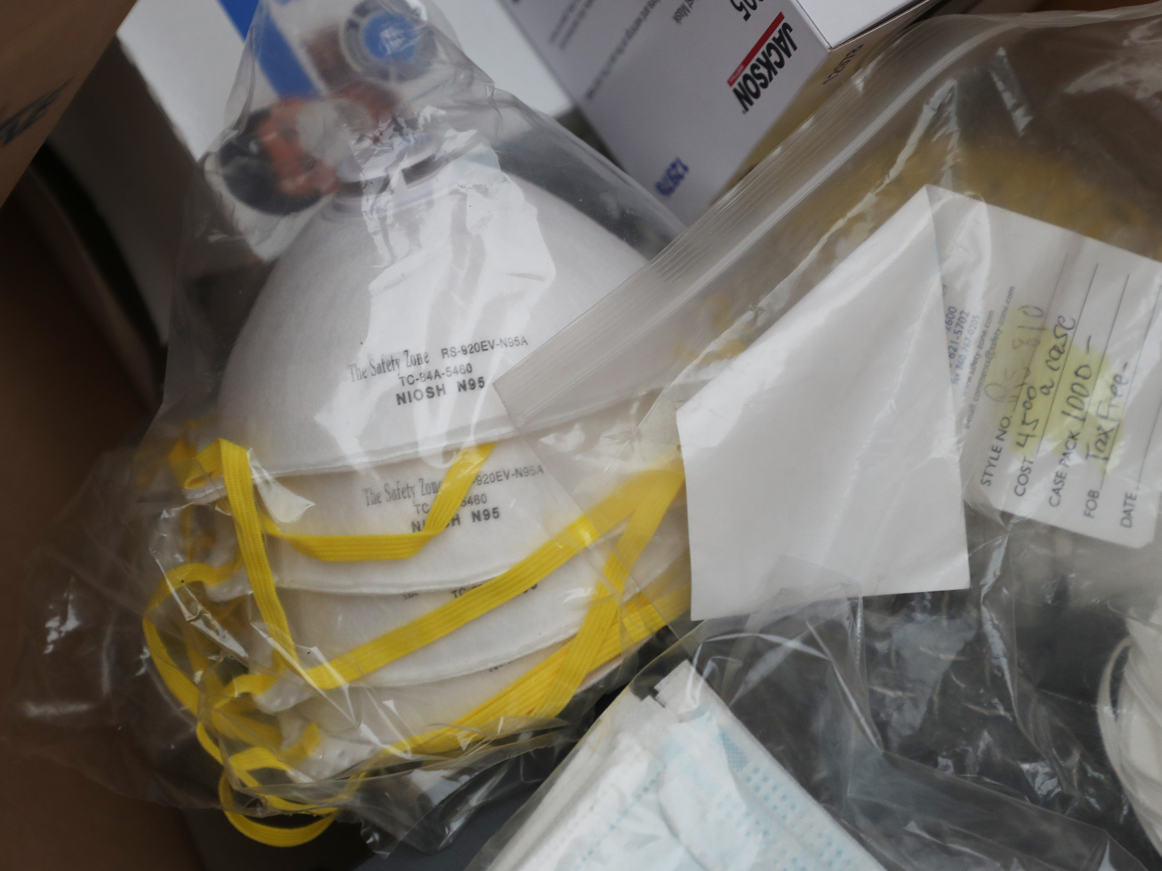 caption: N95 masks are seen during a donation drive this week.