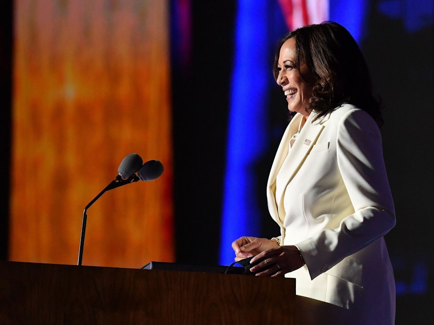 caption: Vice President-elect Kamala Harris delivers remarks in Wilmington, Del., Saturday evening.