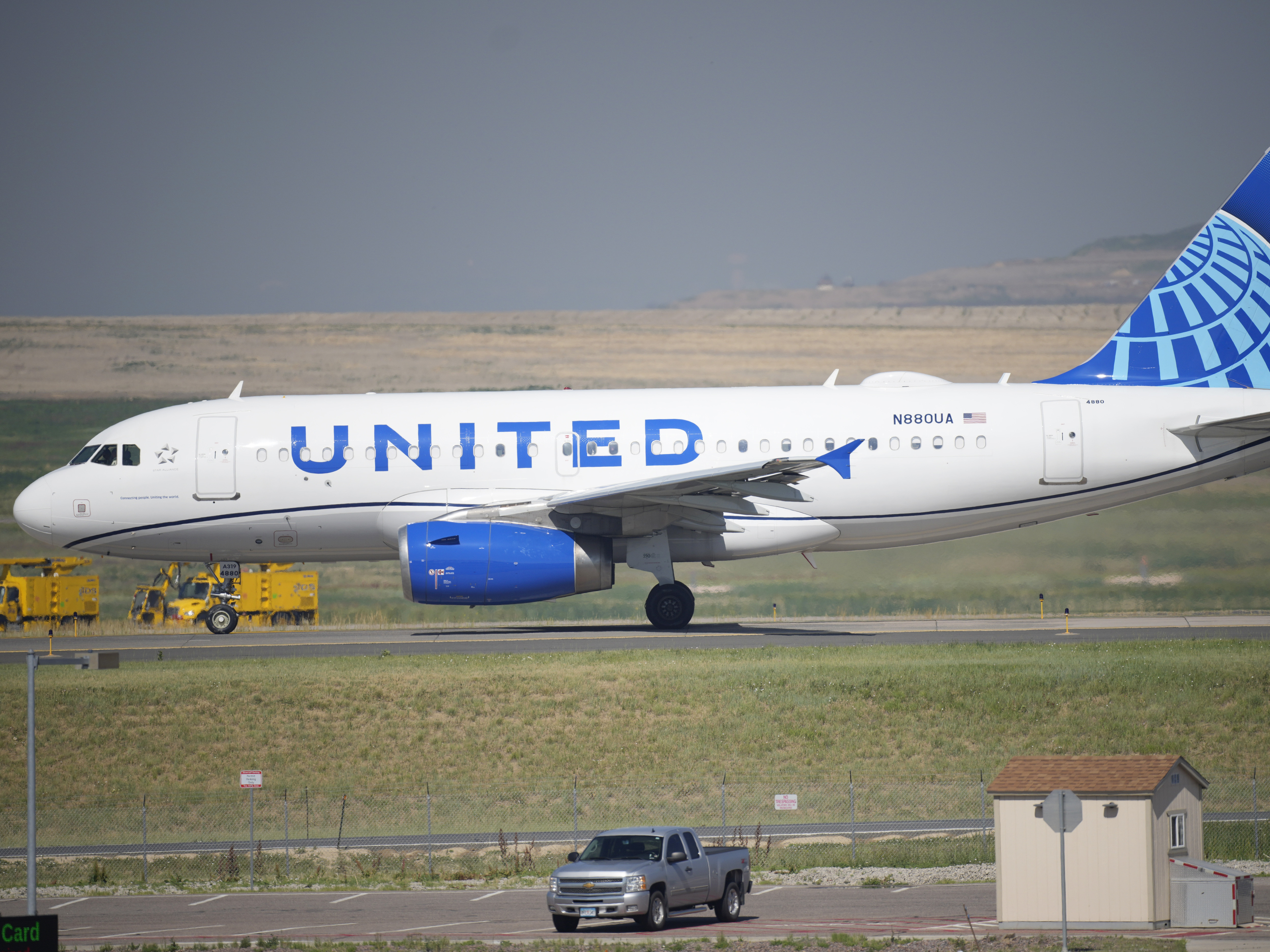 caption: A United Airlines jetliner taxis down a runway for take off from Denver International Airport last month. The carrier has become the first major U.S. airline to require employees be vaccinated against COVID-19.