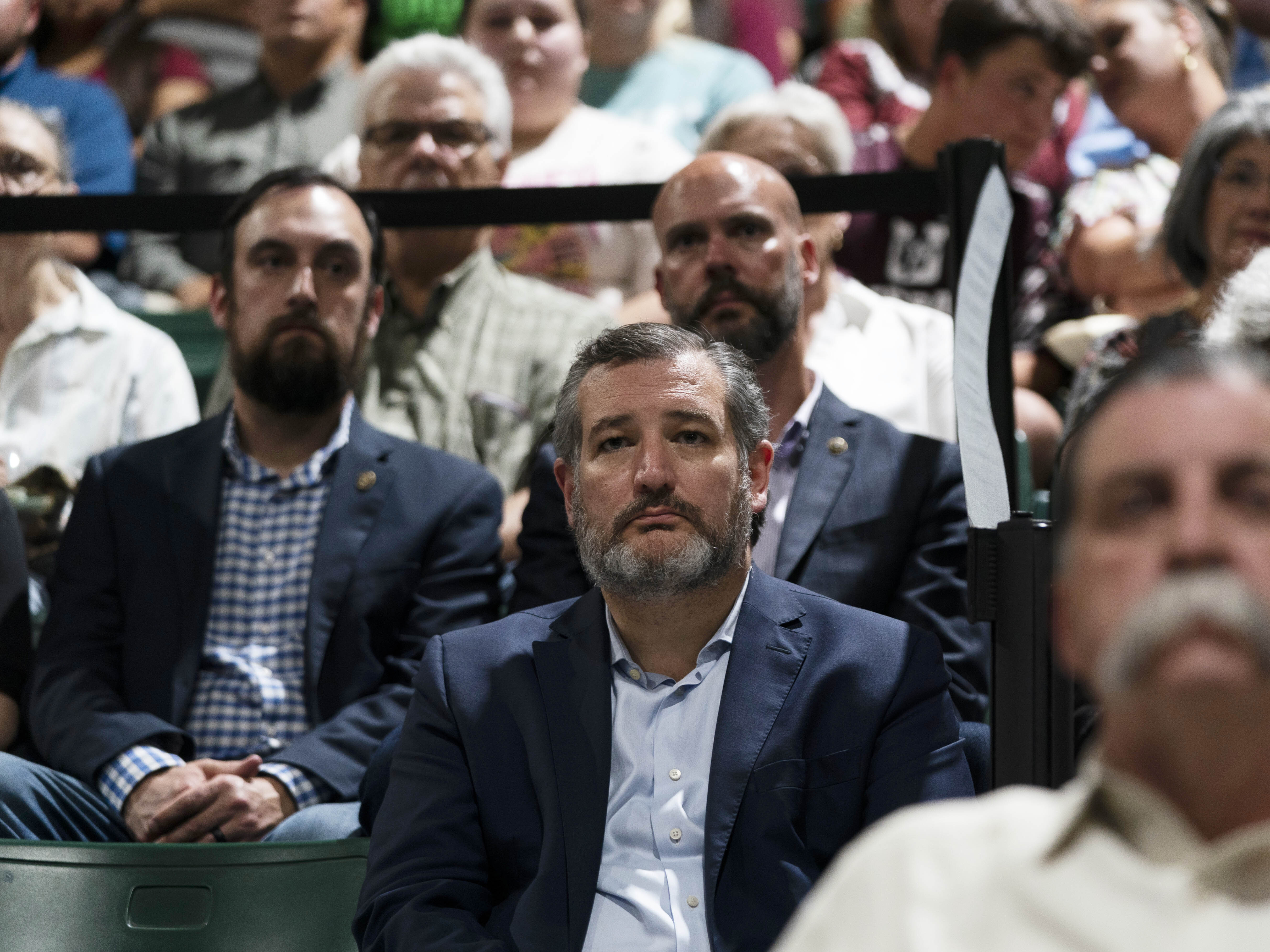 caption: Sen. Ted Cruz, R-Texas, attends a prayer vigil in Uvalde, Texas, Wednesday, May 25, 2022. The vigil was held to honor the victims killed in Tuesday's shooting at Robb Elementary School.