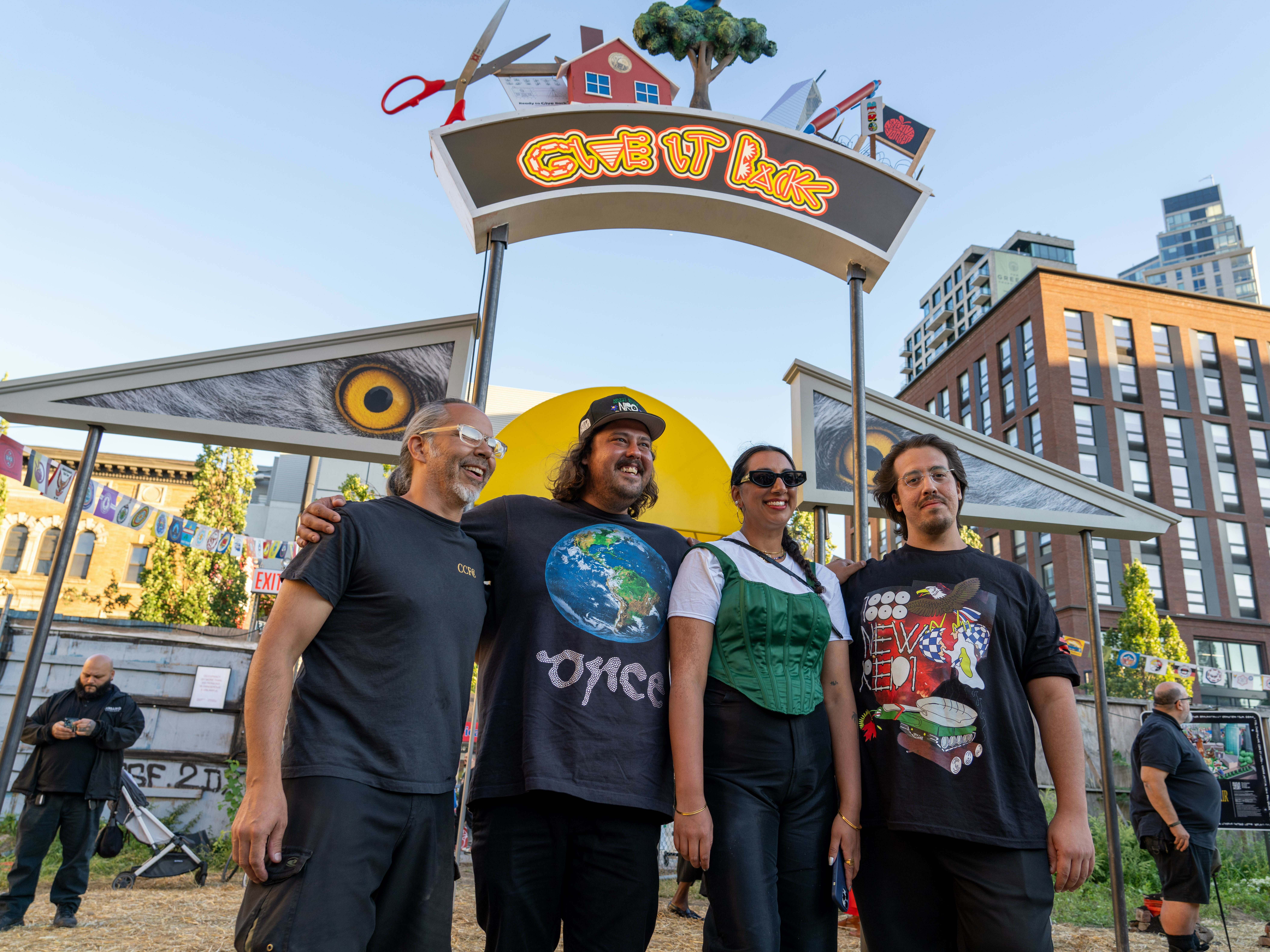 caption: The artists, brothers Adam and Zack Khalil and Jackson Polys, are part of the collective the New Red Order. They call it a "public secret society." Here they are with Creative Time curator Diya Vij.
